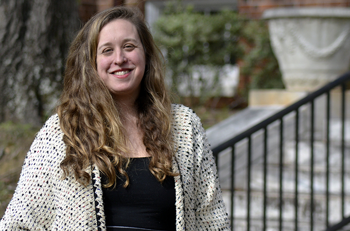 Faculty member Karen Bray smiles for the camera outside of Tate Building.