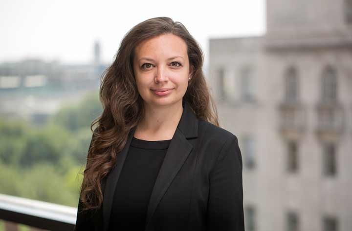 Yuliya-Ivanovass with buildings behind her.