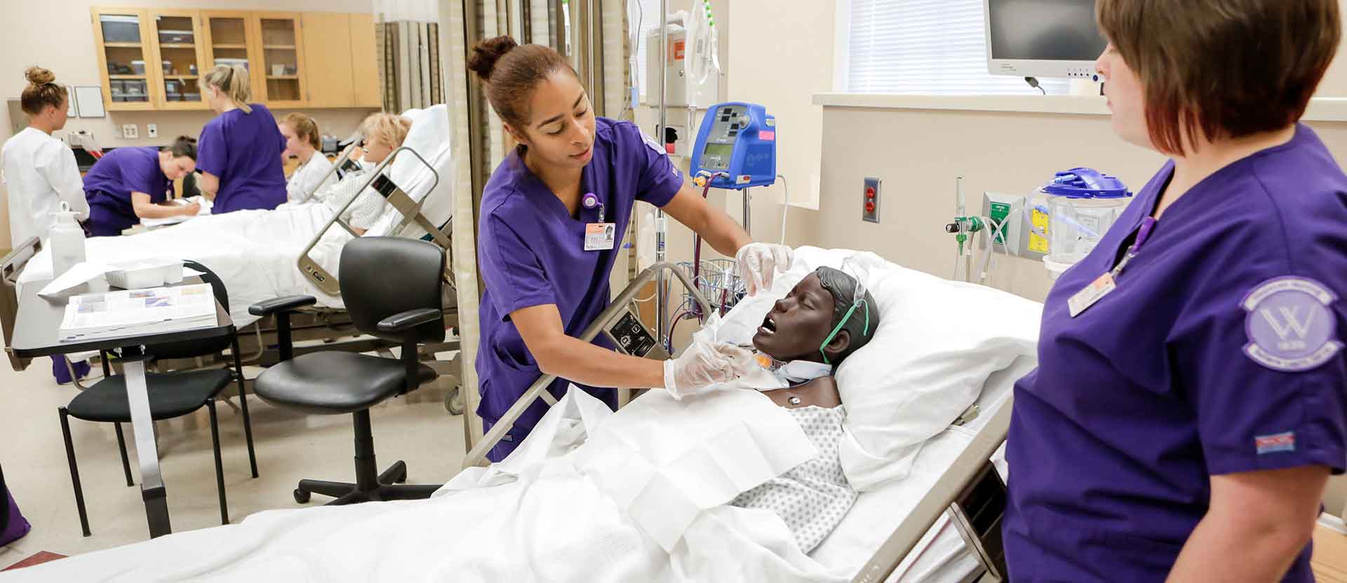 Nursing students practice procedures in Nursing Lab