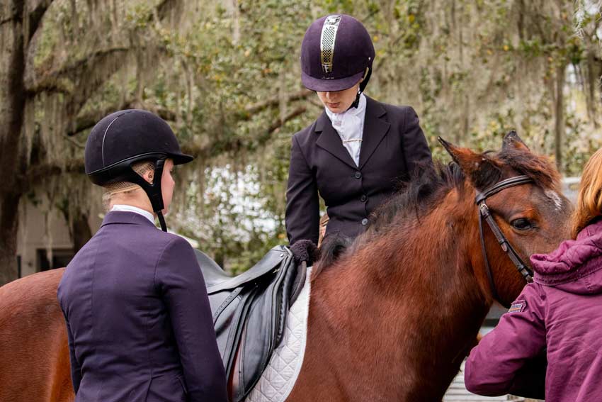 Two students with horse.